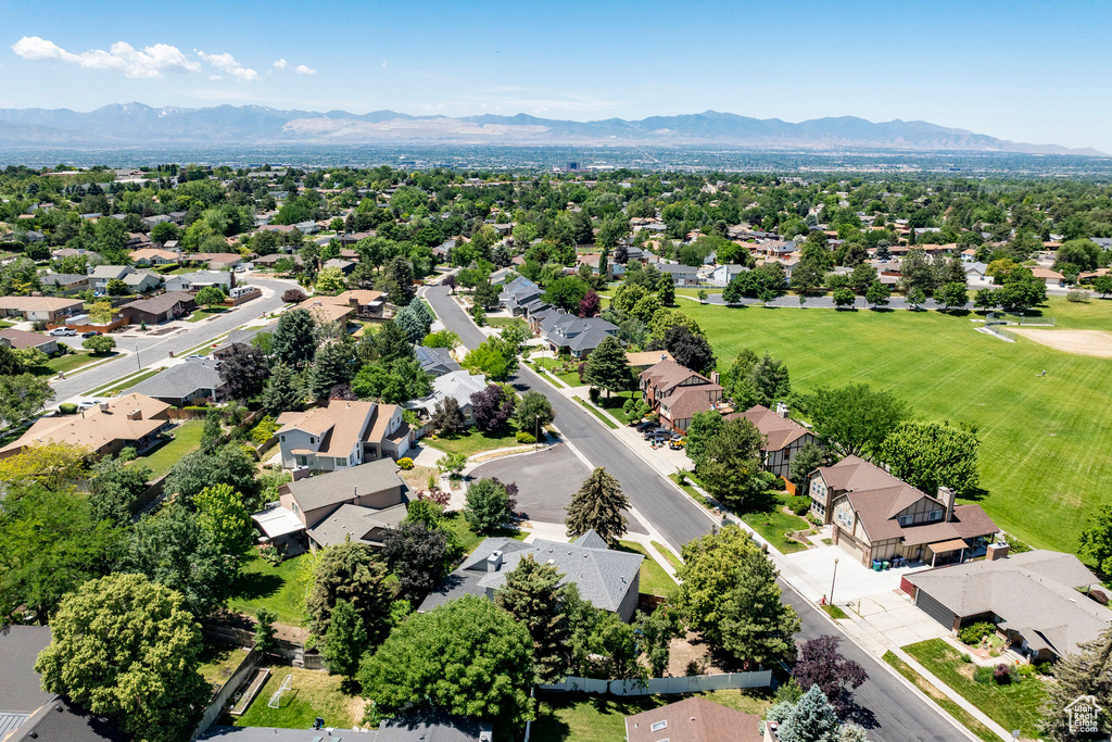 Aerial perspective of suburban area featuring a mountain backdrop