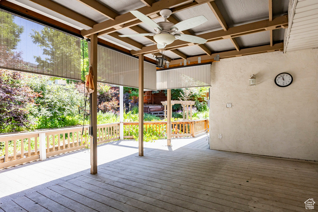 Wooden deck featuring ceiling fan