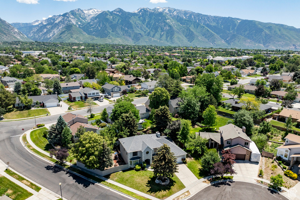 Aerial view of residential area with a mountainous background