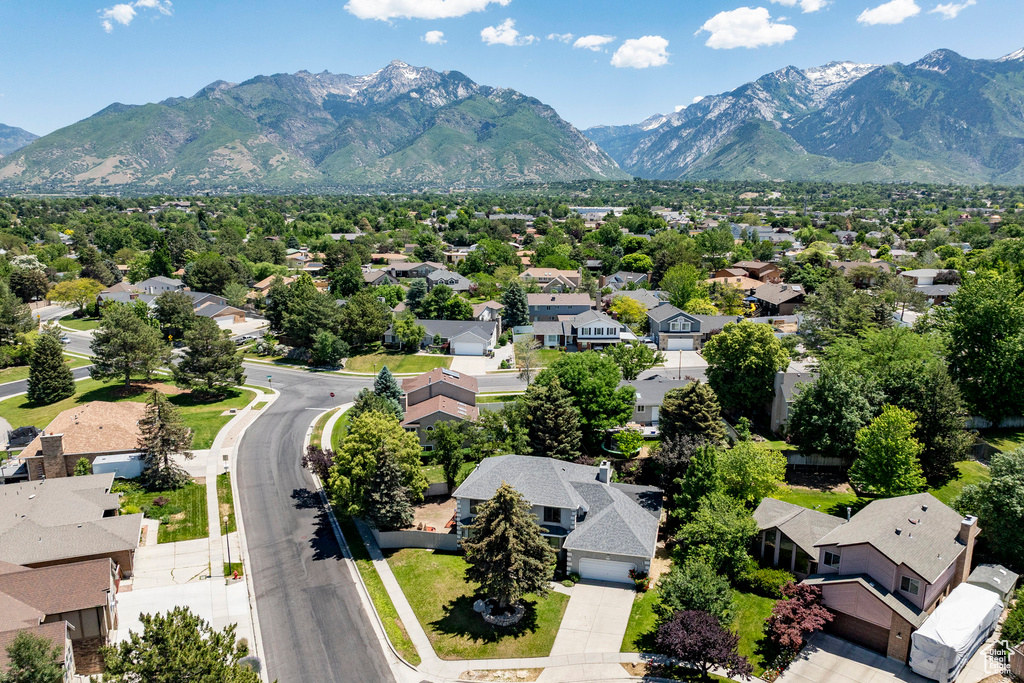 Aerial view of residential area featuring a mountain backdrop