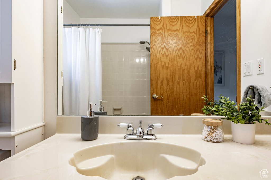 Bathroom with vanity and a shower with curtain