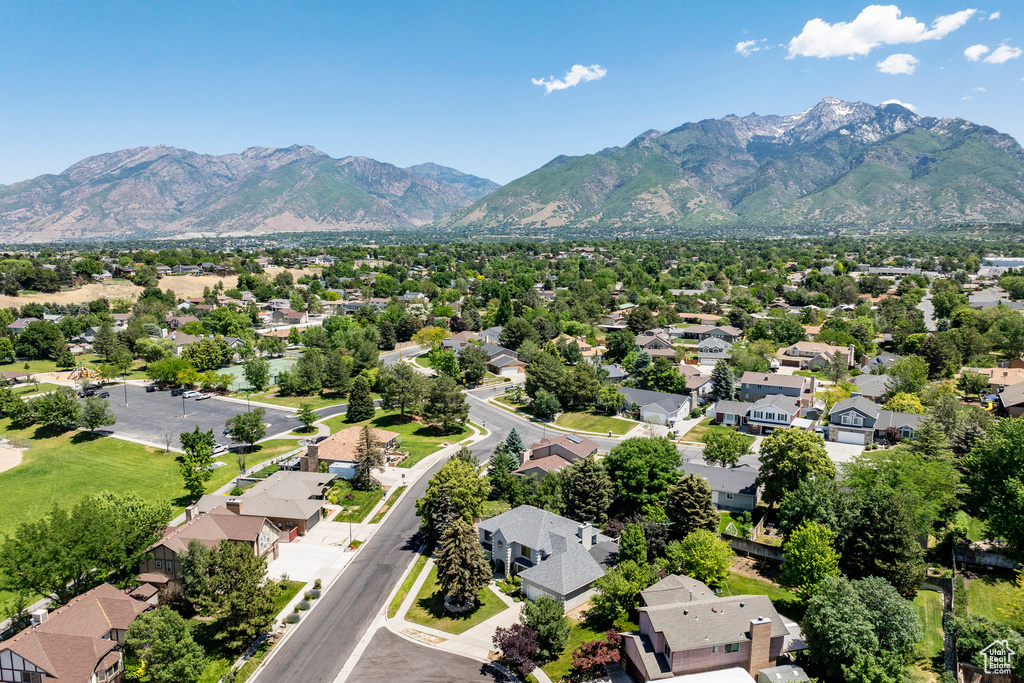 Aerial view of residential area featuring a mountainous background