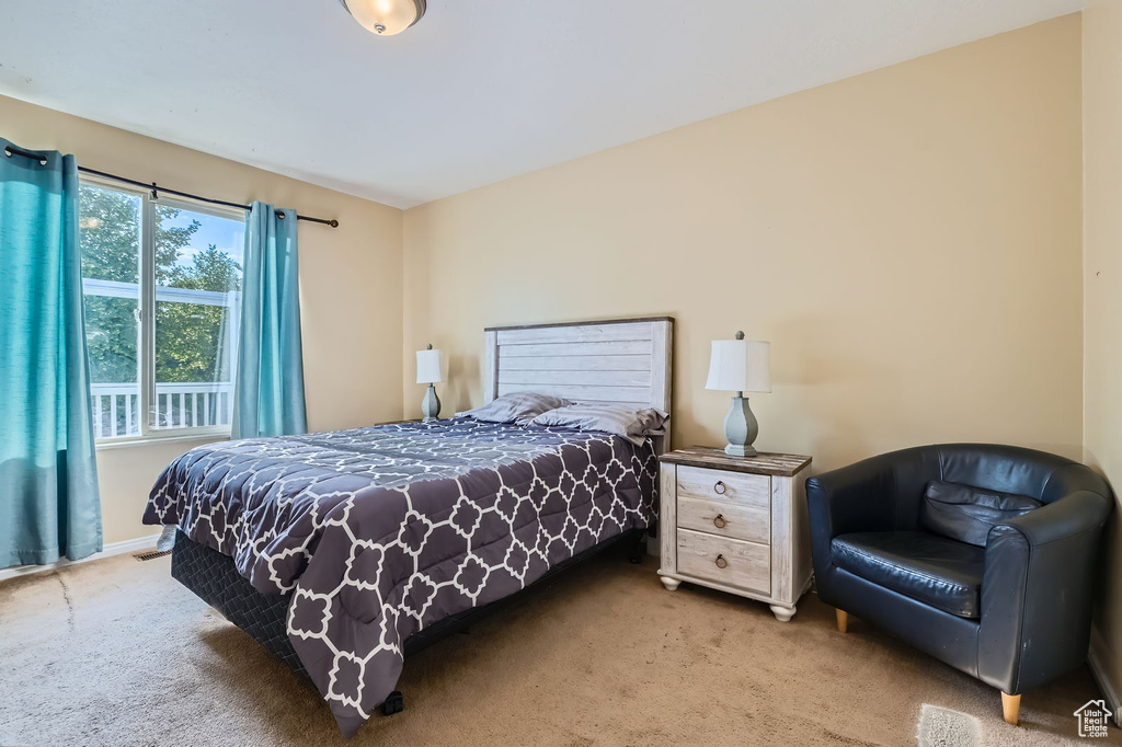 Bedroom with carpet and baseboards