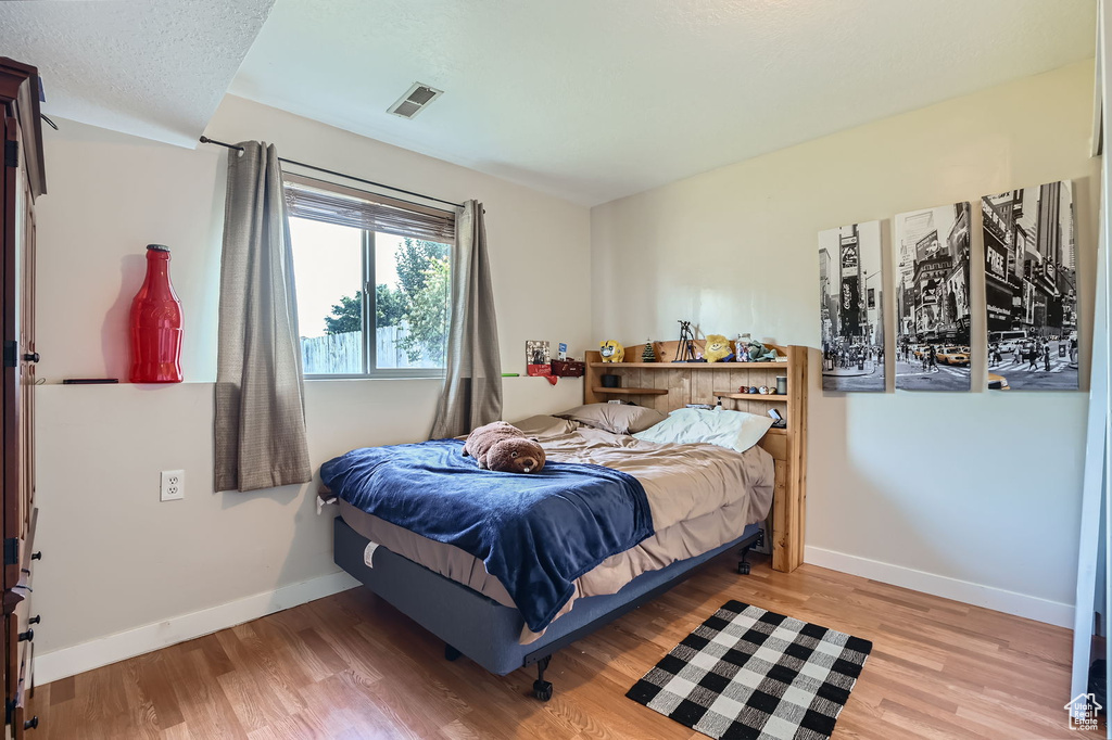 Bedroom featuring light wood-type flooring
