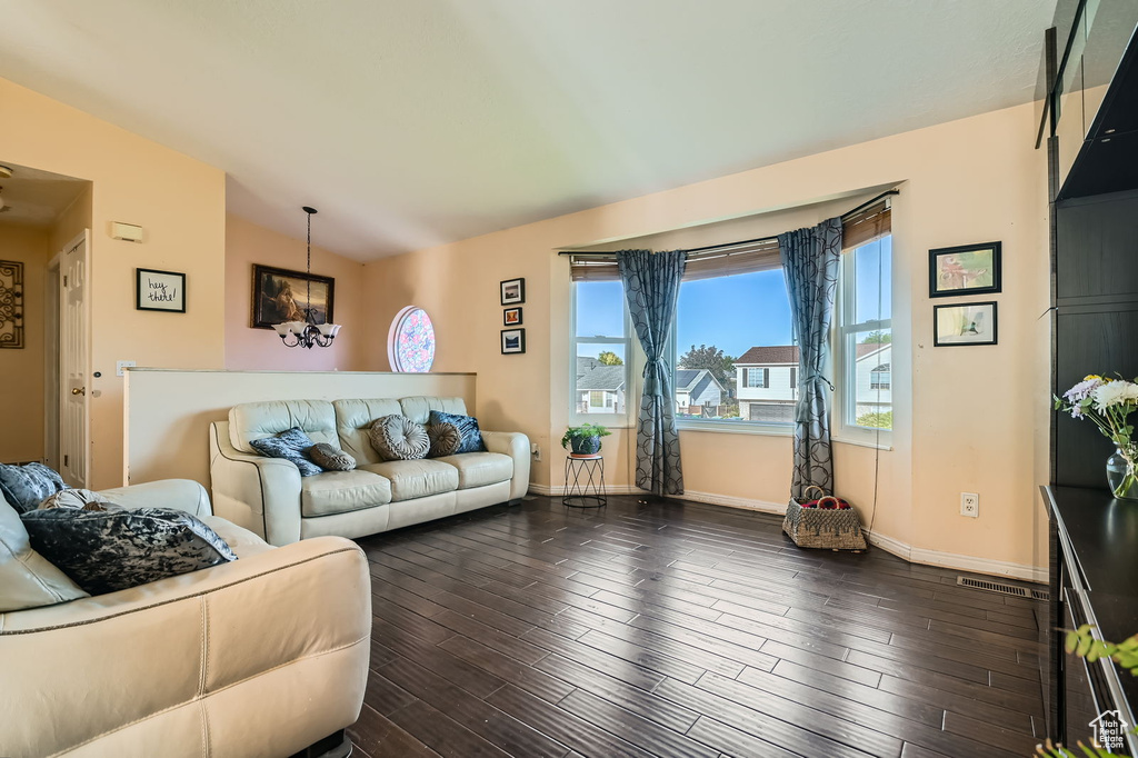 Living area with dark wood finished floors and baseboards