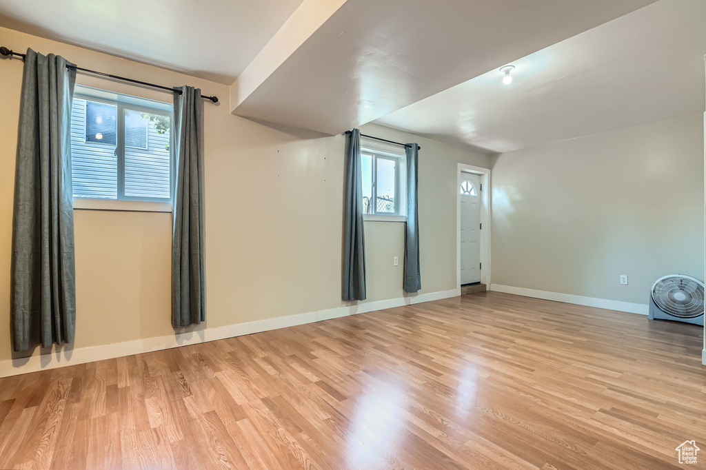 Empty room with light wood-style flooring
