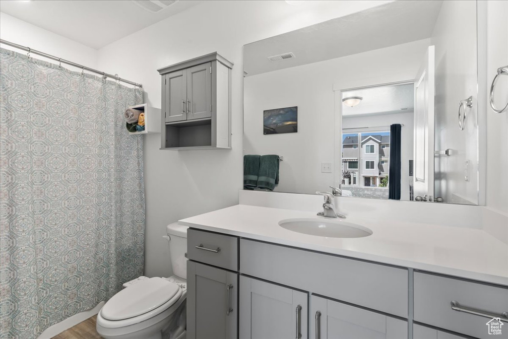 Full bath featuring vanity and a shower with curtain