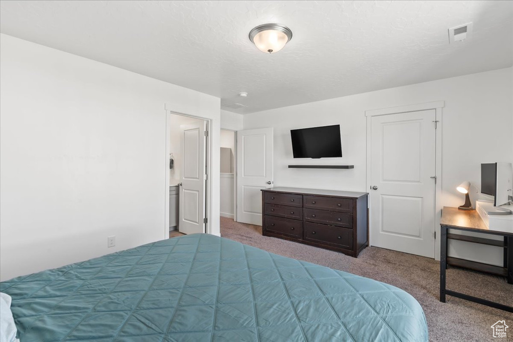 Bedroom with carpet flooring