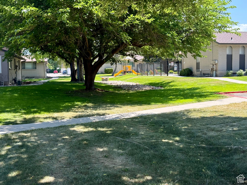 View of grassy yard with a playground