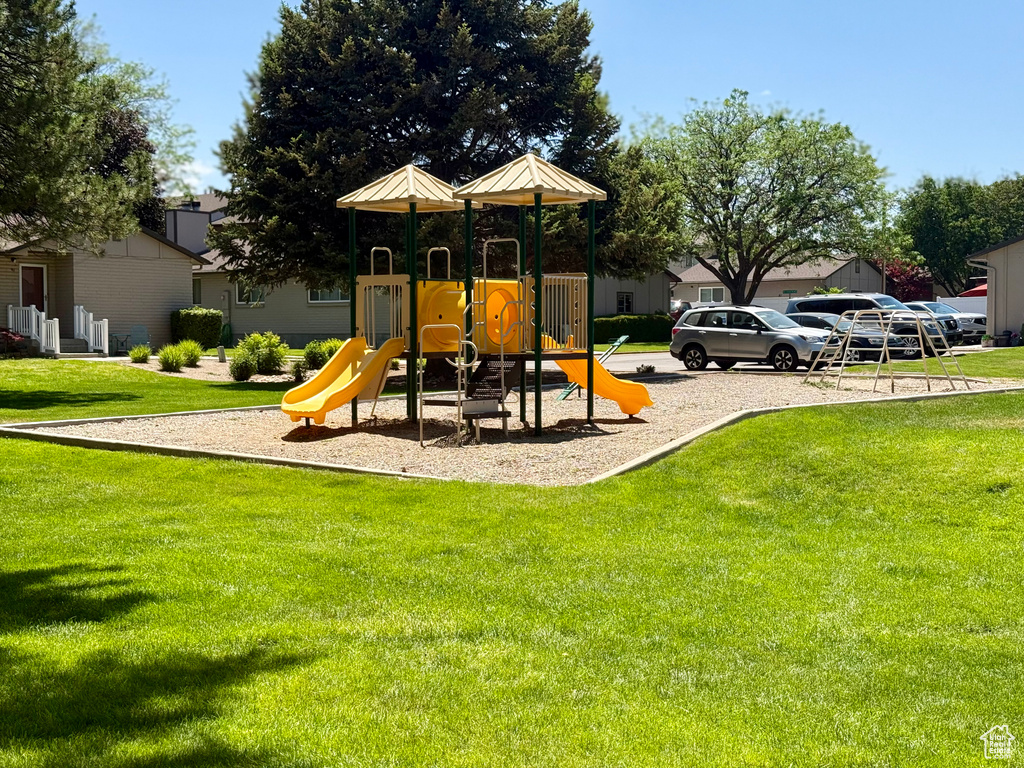 Community playground featuring a lawn