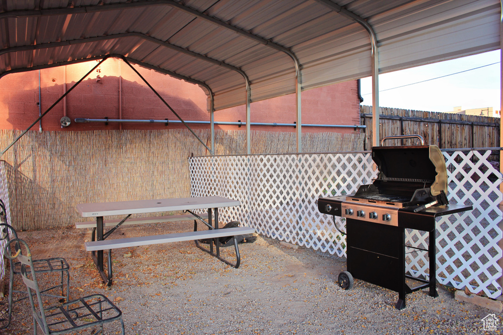 View of patio / terrace featuring grilling area and a carport
