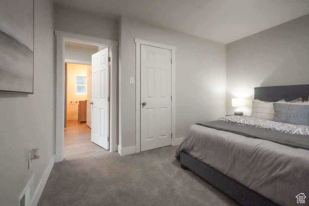 Bedroom featuring baseboards and carpet flooring