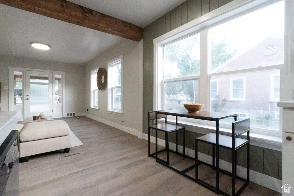 Sunroom / solarium featuring beamed ceiling