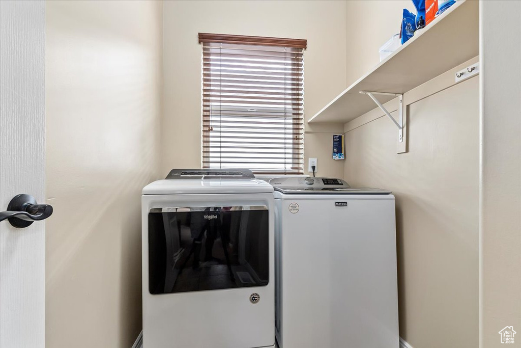 Laundry room featuring washing machine and clothes dryer