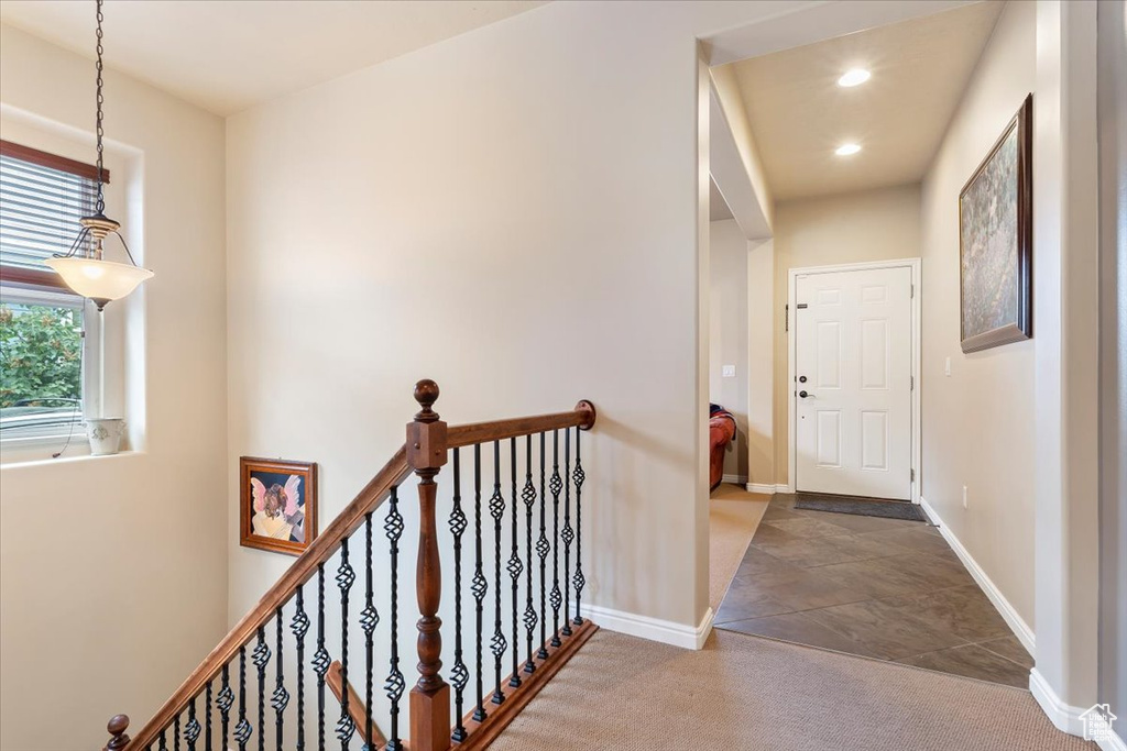 Hall featuring recessed lighting, an upstairs landing, and carpet