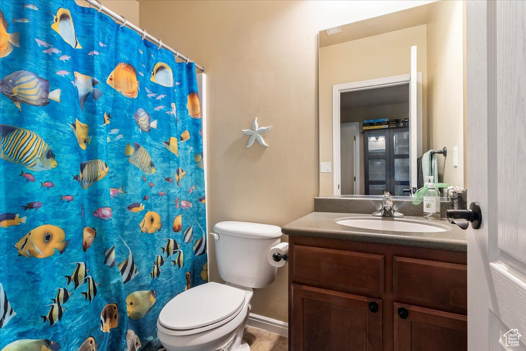 Full bathroom featuring vanity and a shower with curtain
