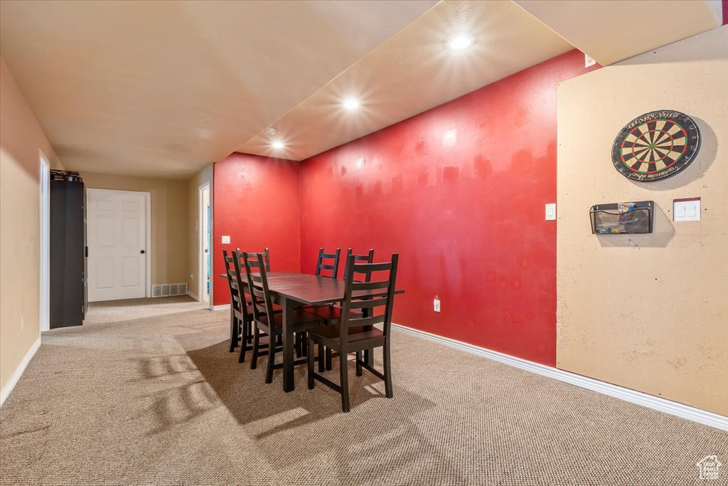 Dining space featuring recessed lighting and carpet flooring