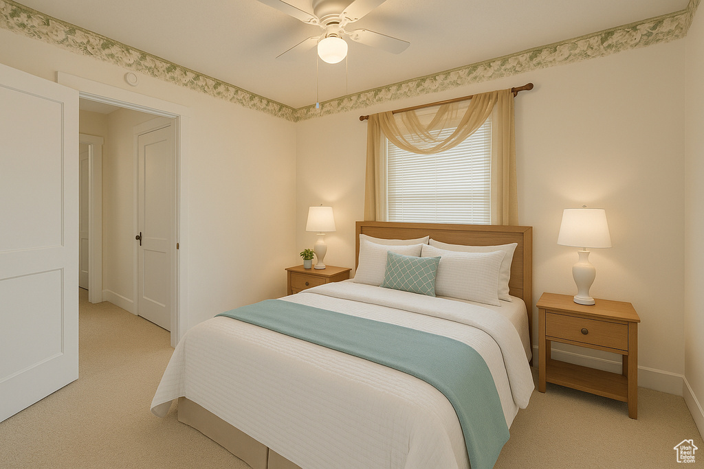 Bedroom with light carpet and a ceiling fan
