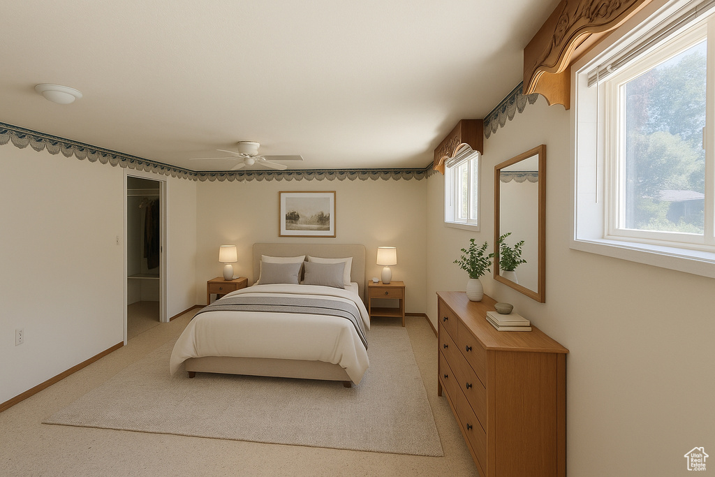Bedroom with a ceiling fan and baseboards