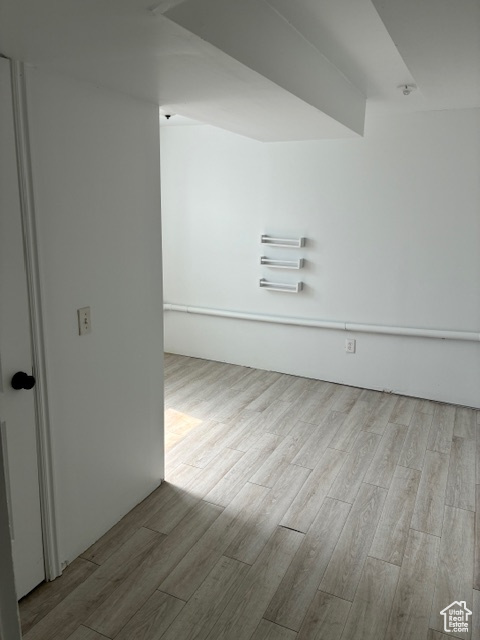 Spare room featuring wood finished floors