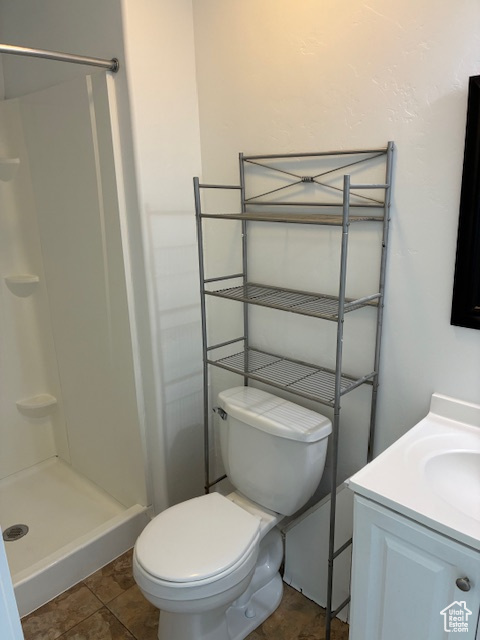 Bathroom featuring vanity and a shower stall