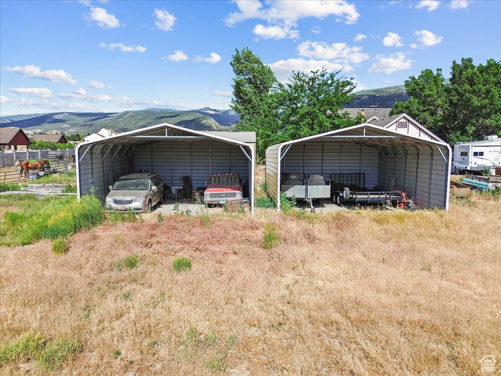View of outbuilding featuring a detached carport and a mountain view