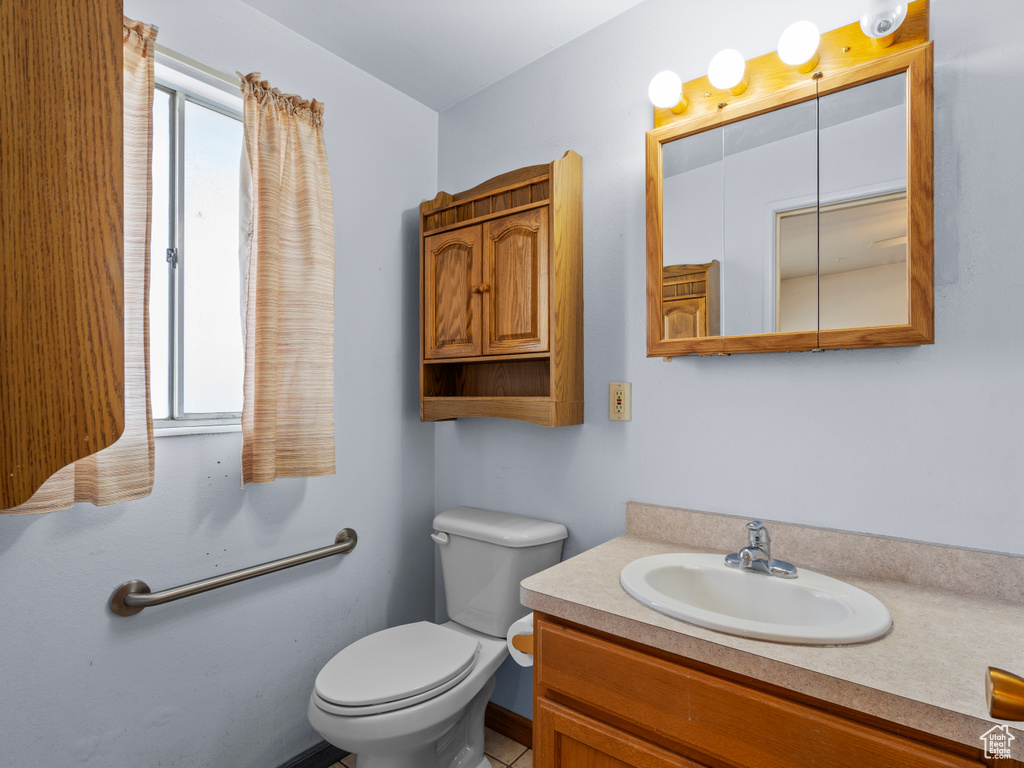 Bathroom featuring toilet and vanity