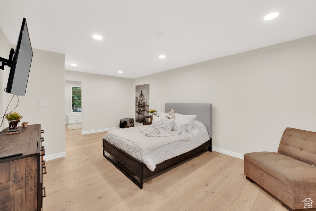 Bedroom with light wood-type flooring and recessed lighting