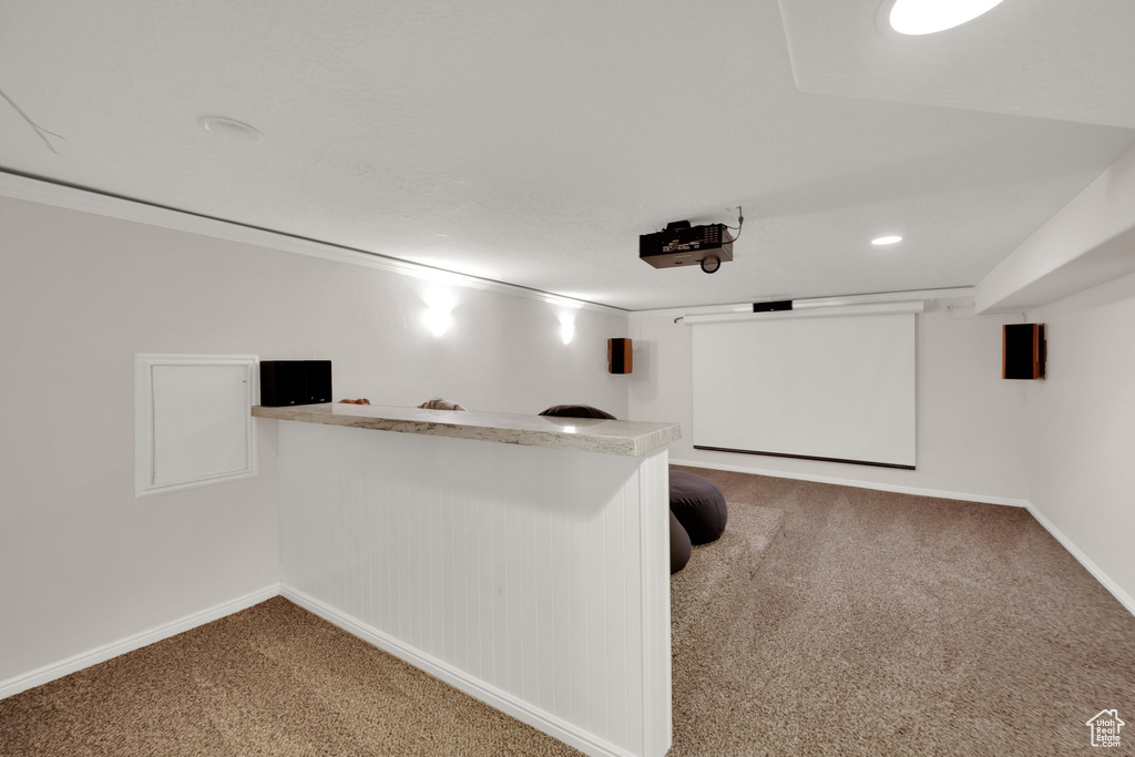 Cinema room featuring carpet, bar area, and recessed lighting