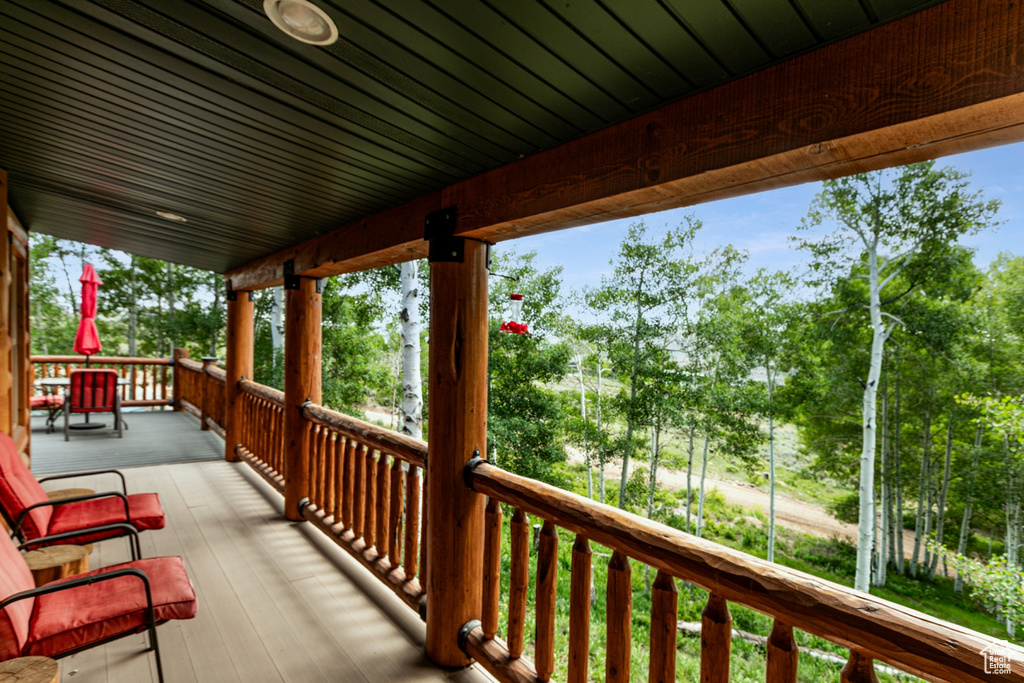 Wooden terrace with view of scattered trees
