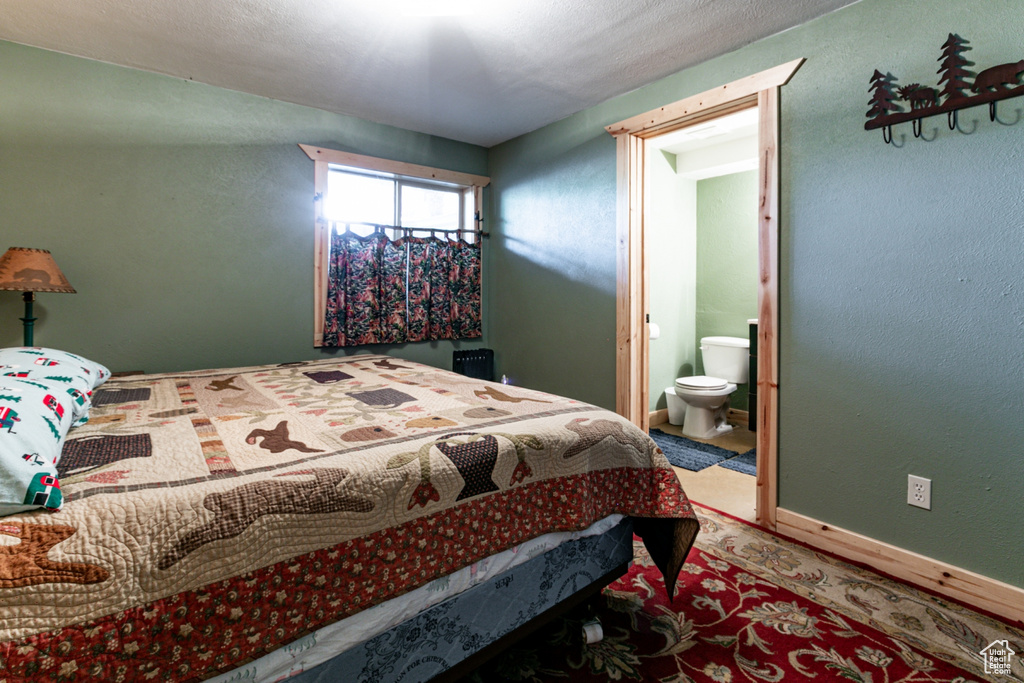 Bedroom featuring ensuite bathroom