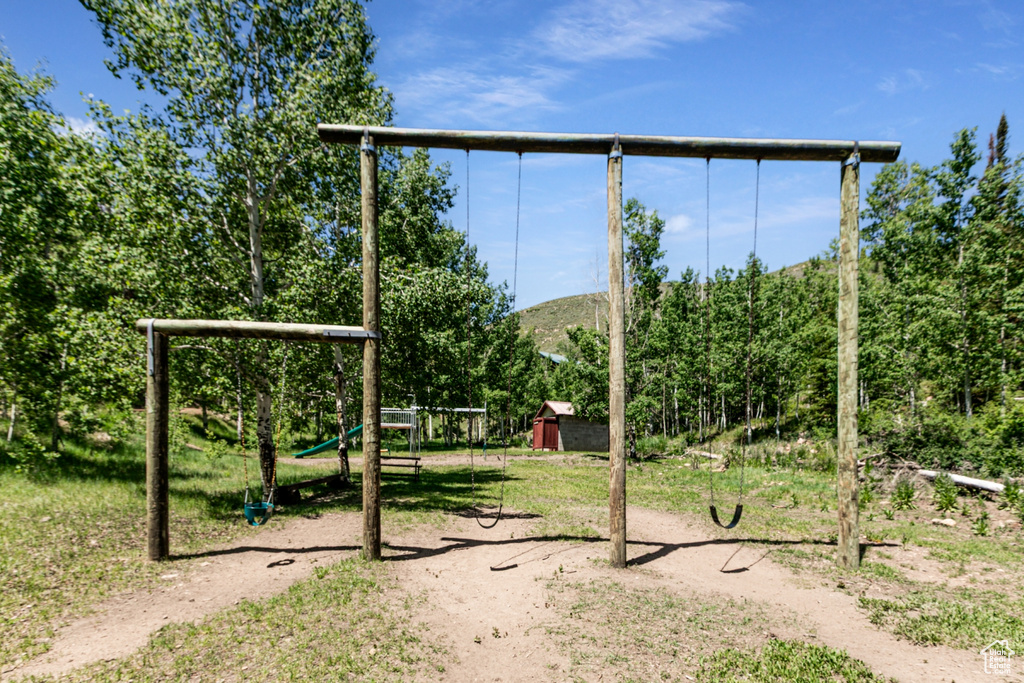 View of yard featuring a playground and a mountain view