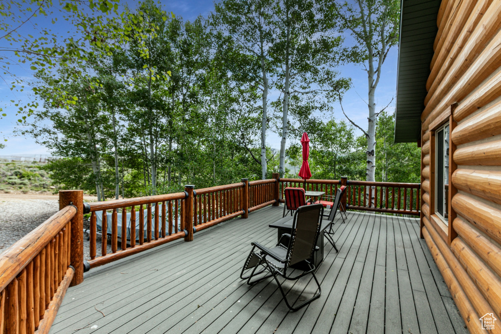 Wooden deck featuring outdoor dining area