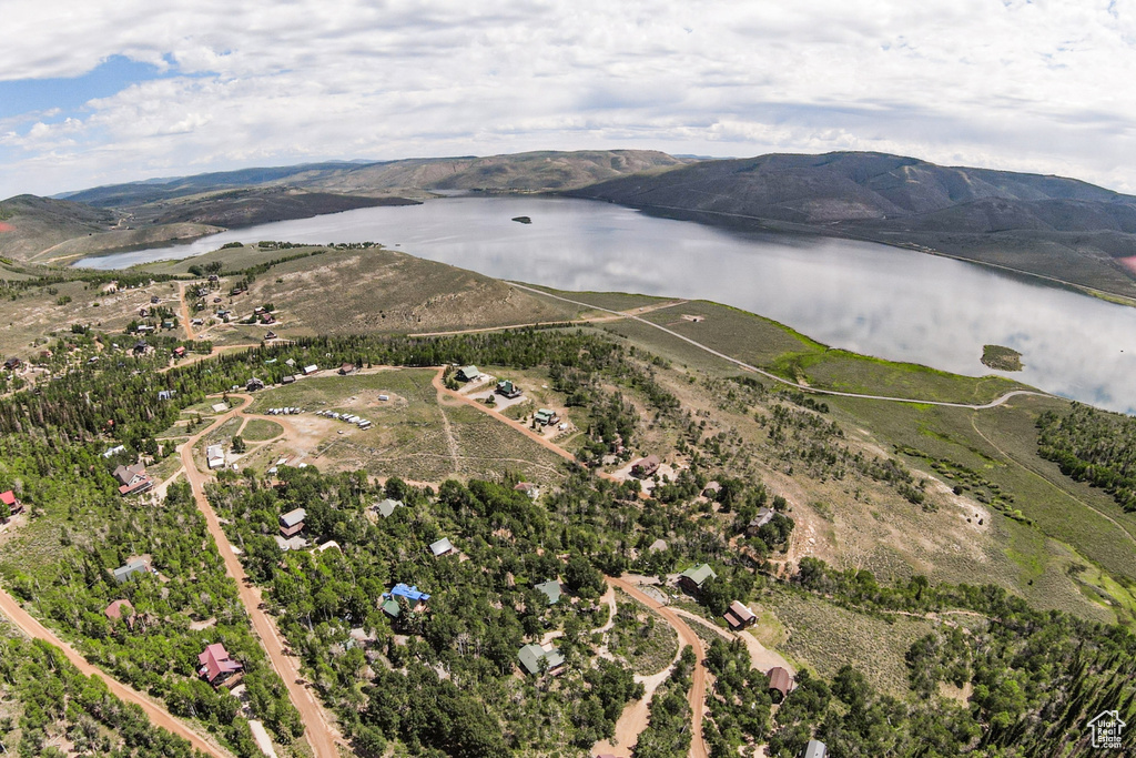 Aerial view of property's location featuring a water and mountain view