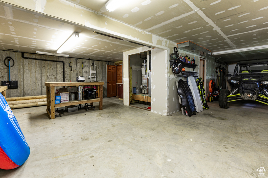 Basement featuring a garage and a workshop area