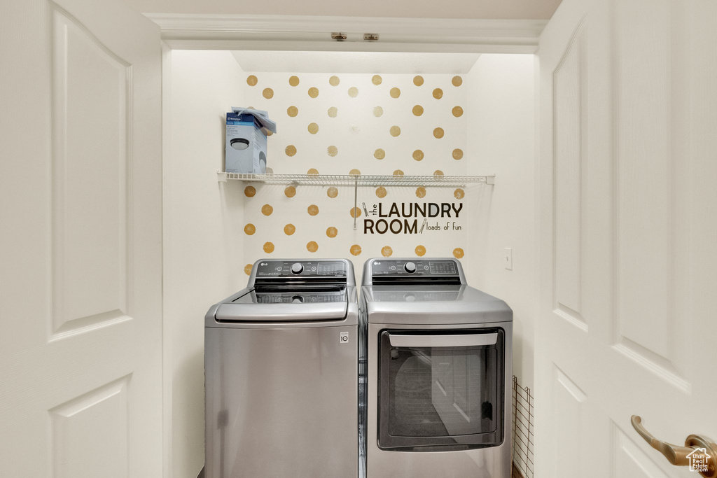 Laundry area featuring washer and clothes dryer