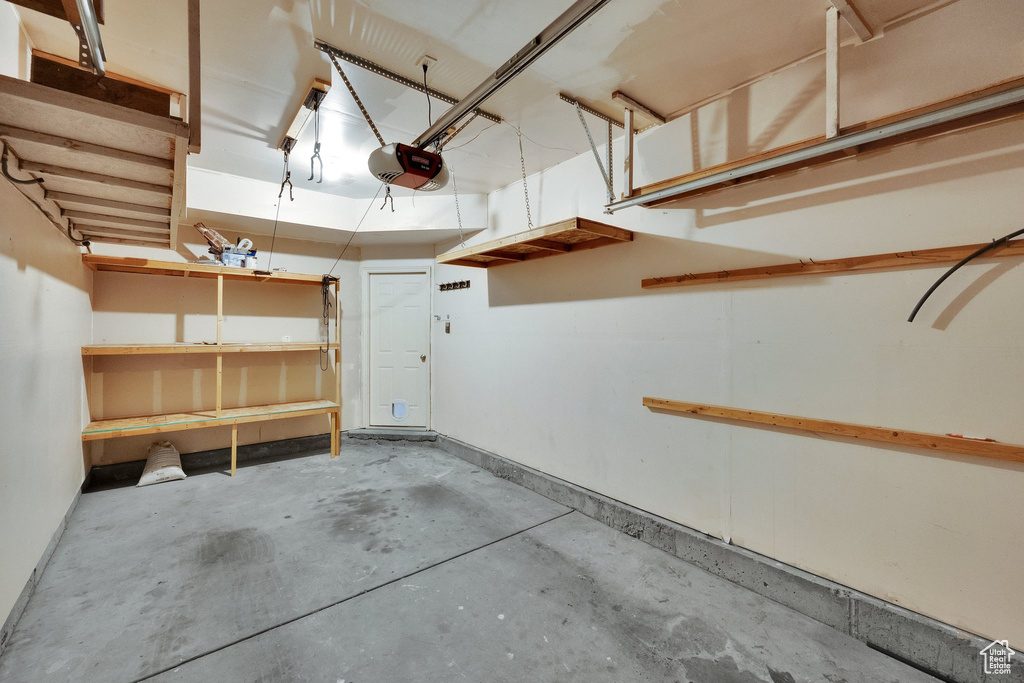 Garage featuring a garage door opener