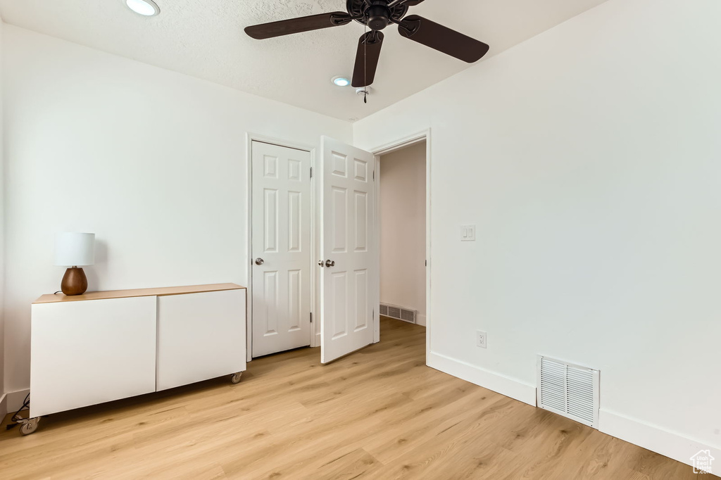Unfurnished bedroom featuring light wood-style flooring, recessed lighting, and ceiling fan