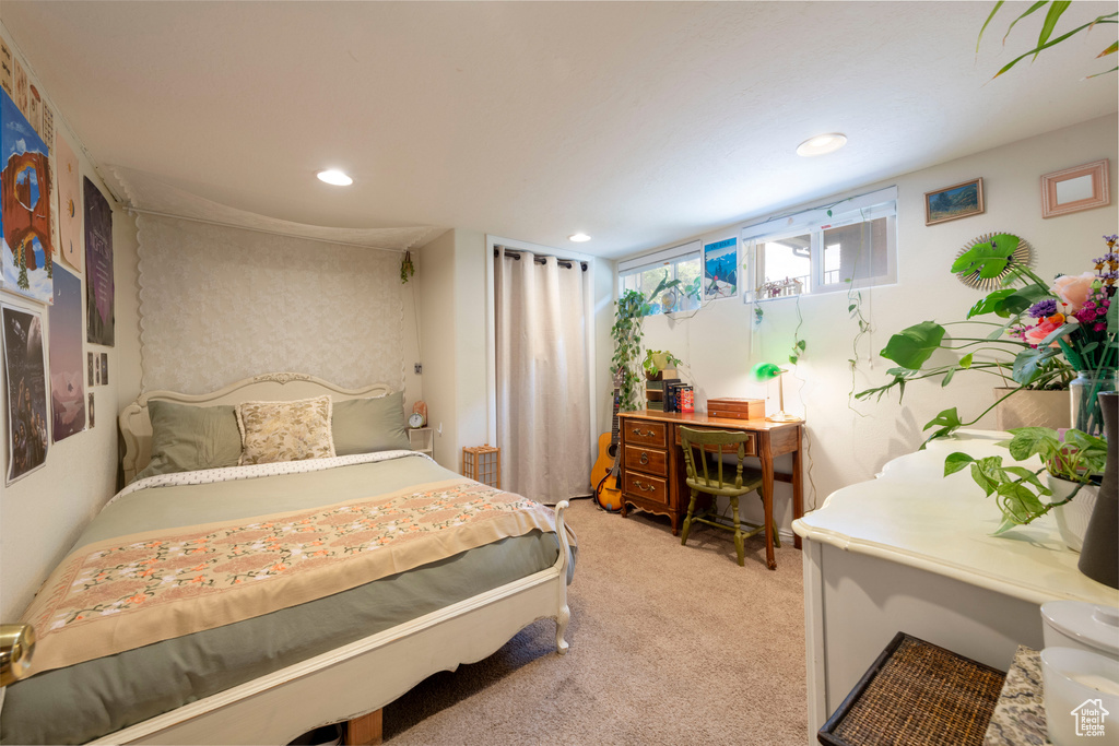 Bedroom with light carpet and recessed lighting