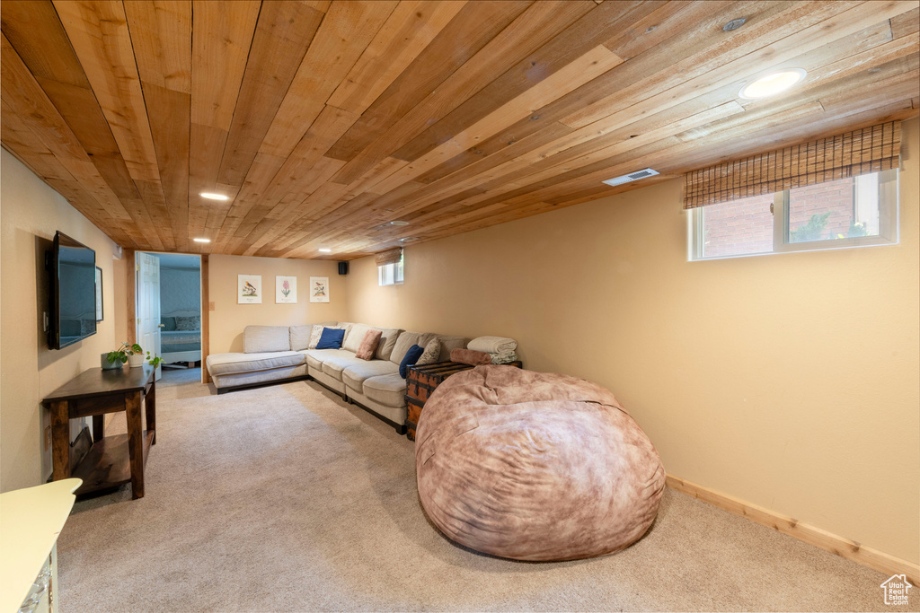 Living room featuring carpet flooring, wooden ceiling, healthy amount of natural light, and recessed lighting