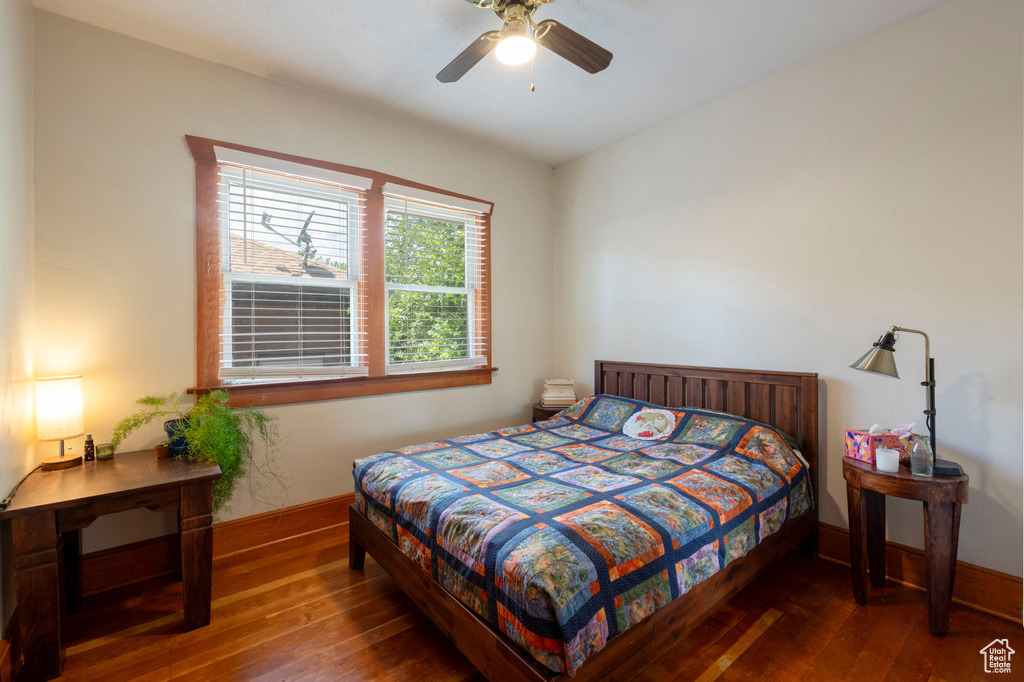 Bedroom with hardwood / wood-style flooring and a ceiling fan