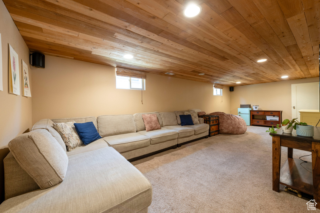 Carpeted living room featuring wooden ceiling and recessed lighting