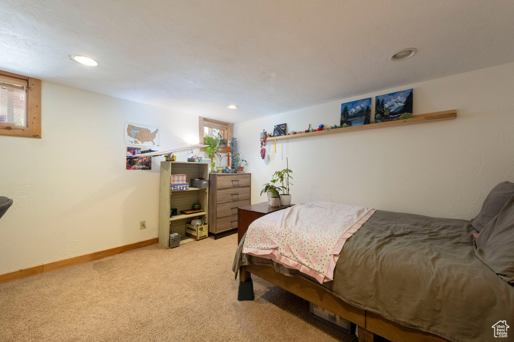 Bedroom featuring light carpet and recessed lighting