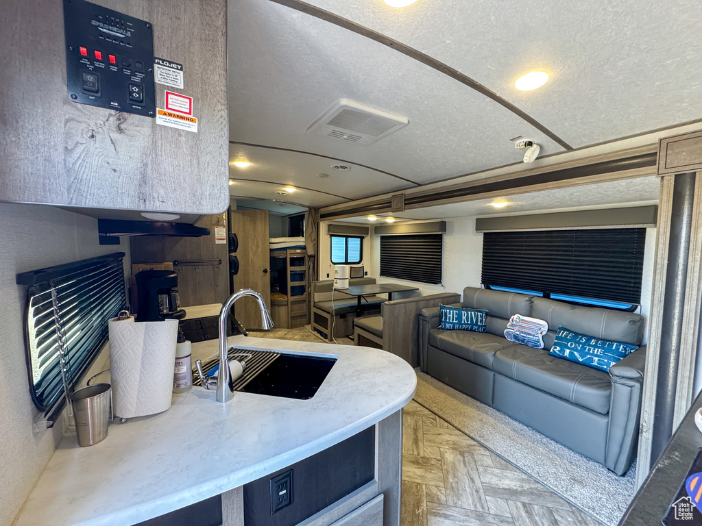 Living area featuring a textured ceiling