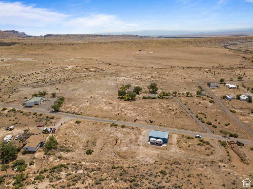 View of property location featuring rural landscape, a desert landscape, and mountains