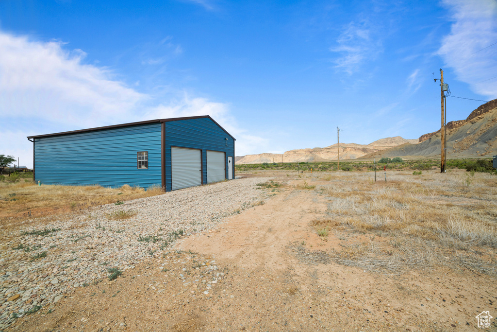 View of outbuilding featuring a mountain view