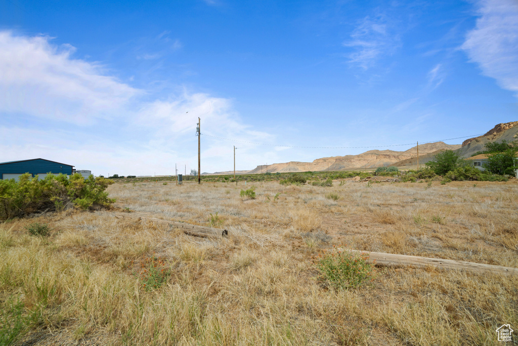 View of mountain background featuring rural landscape