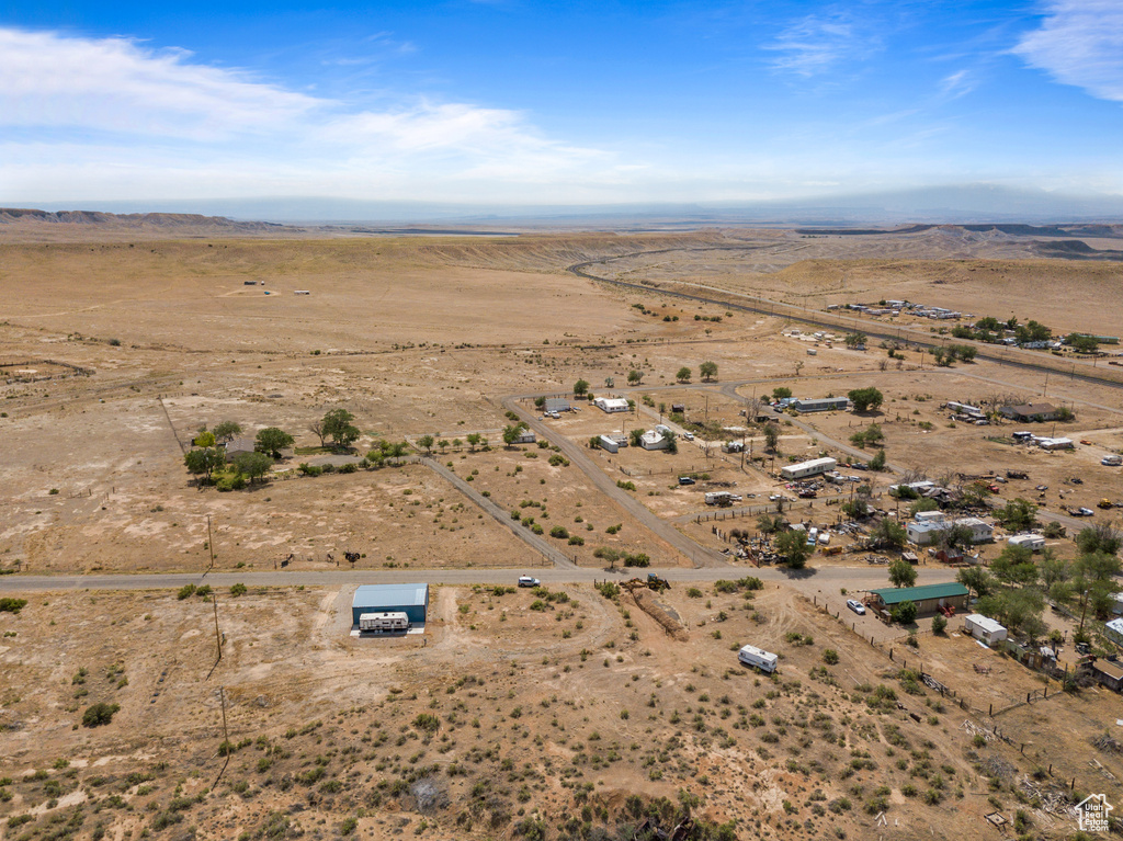 View of property location featuring rural landscape, a desert landscape, and mountains