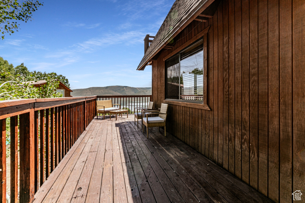 Wooden deck featuring a mountain view