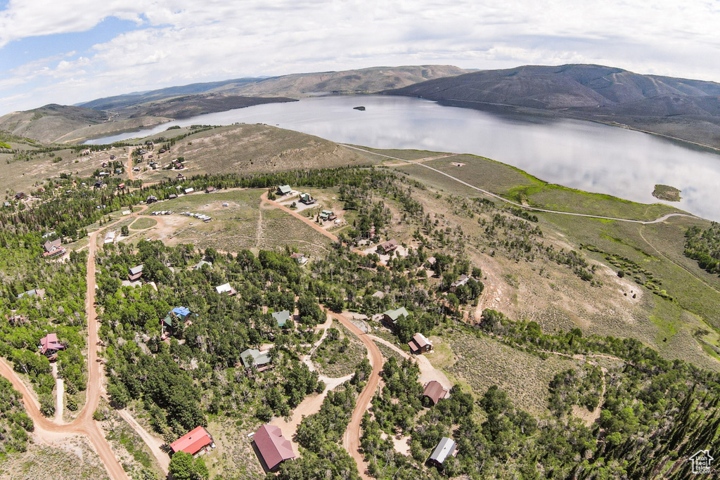 Aerial view of property's location featuring a nearby body of water